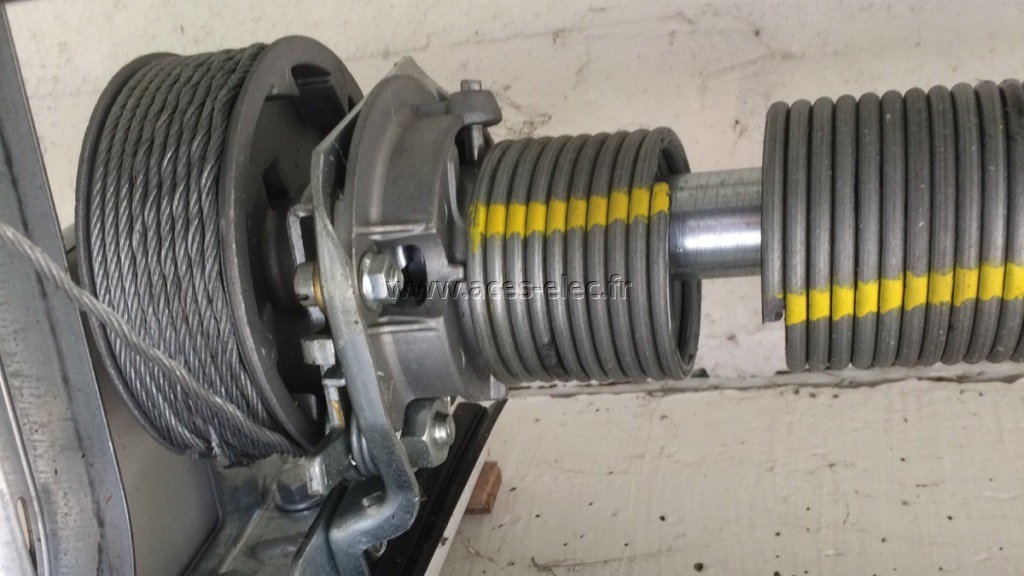 dépannage porte de garage hörmann tubauto : Remplacement d'un kit de ressort de torsion et de câble de traction
